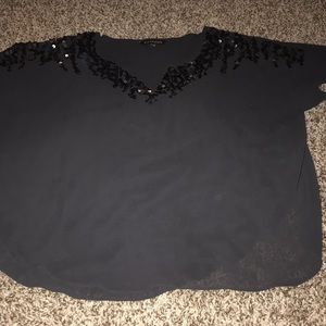 Dark grey top is somewhat sheer